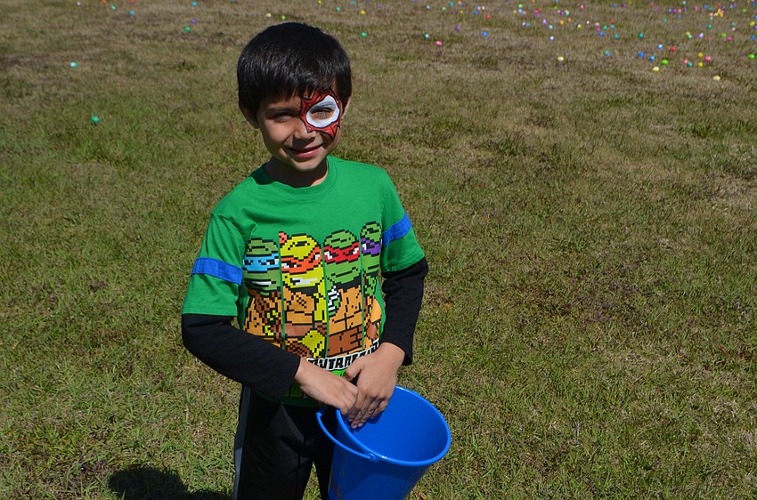 Augusto Strubbe, 6, from Parrish, got his face painted as Spiderman 