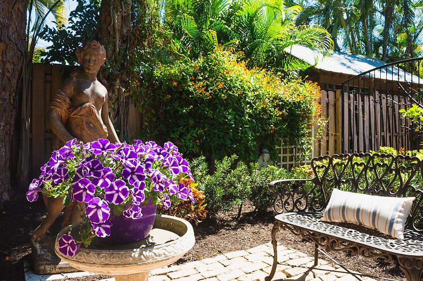 The garden of Cindy Slaalien features a park-like setting.