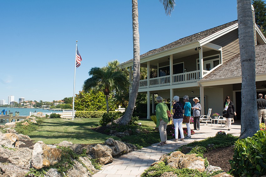 Visitors take in a view of the Sarasota Bay at a Hillview Drive garden.