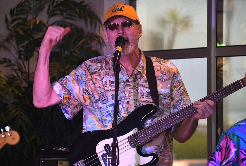 Randell Kirsch, vocals and bass, dances while performing at Islands West.