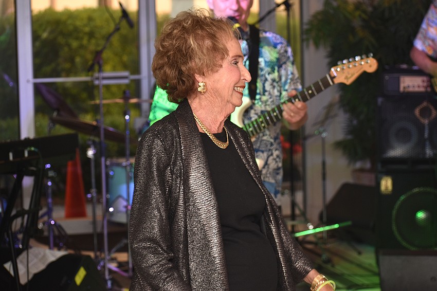 Lenore Miller is all smiles as she dances to California Surf, Incorporated.