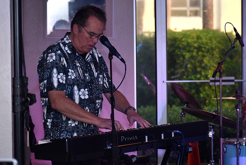 Sterling Smith performs keys during the Islands West performance.