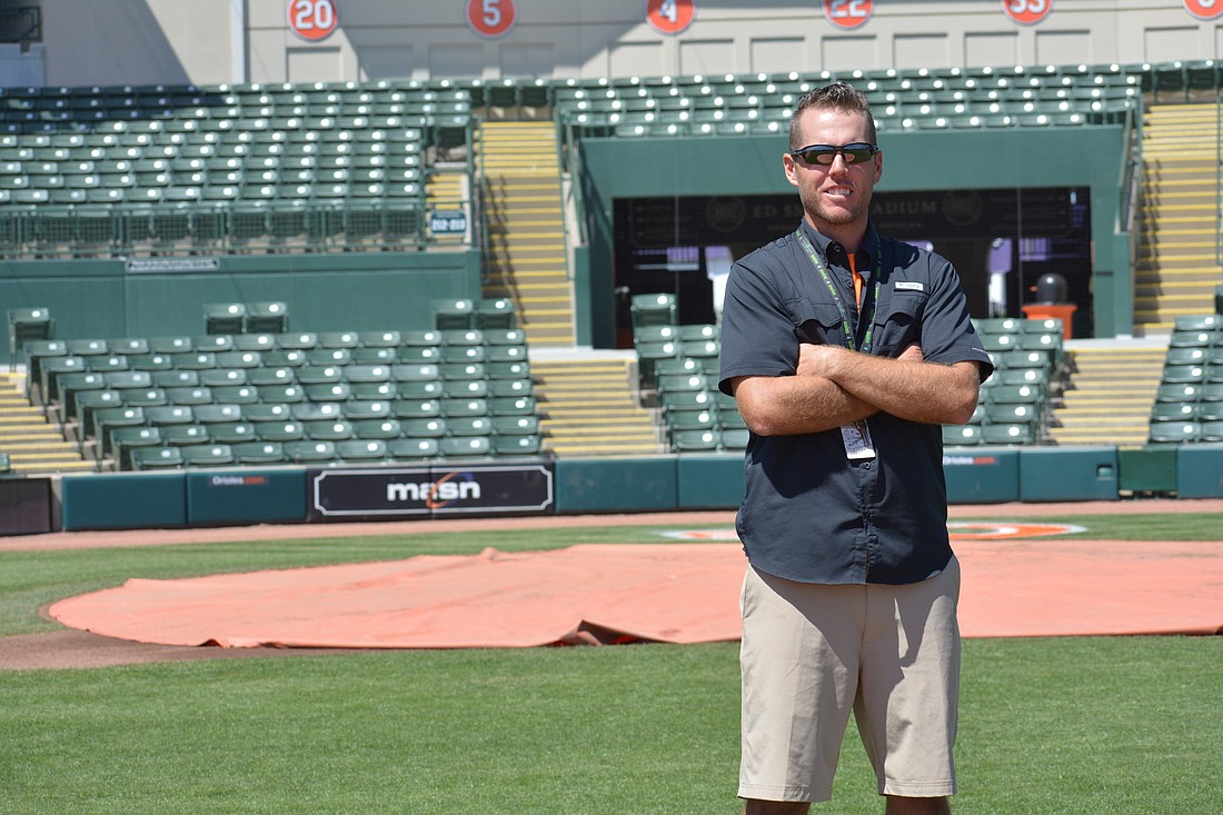 Orioles head groundskeeper of Florida operations Dan Thomas stands on the field he maintains.