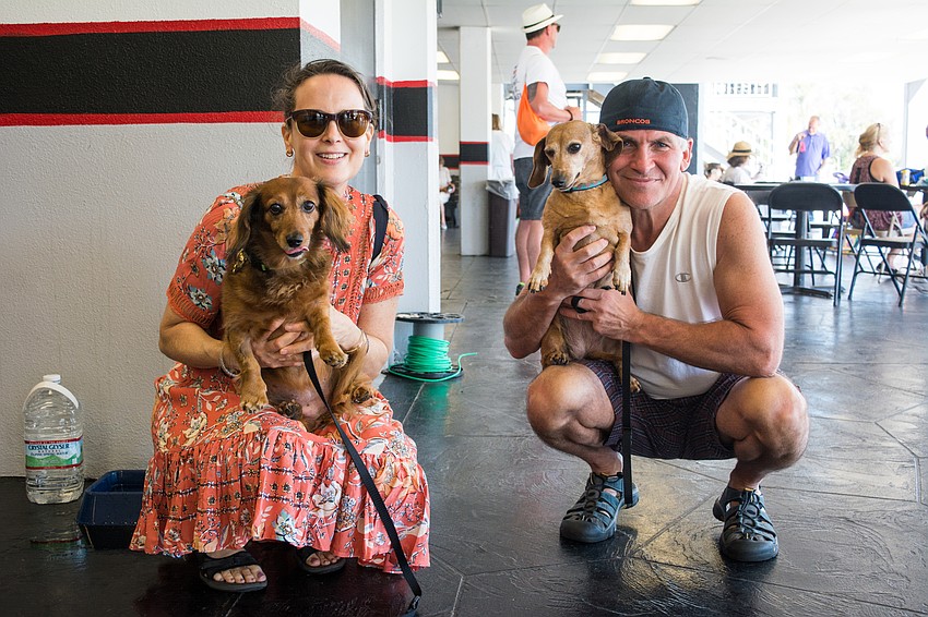 Lynn and Joe Rooney with their miniature dachshunds, Josie and Rosie.