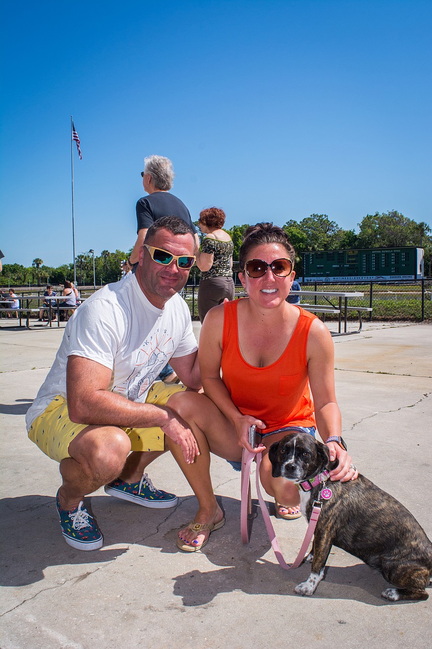 Tyson and Mark Quire with their puggle, Sophie.