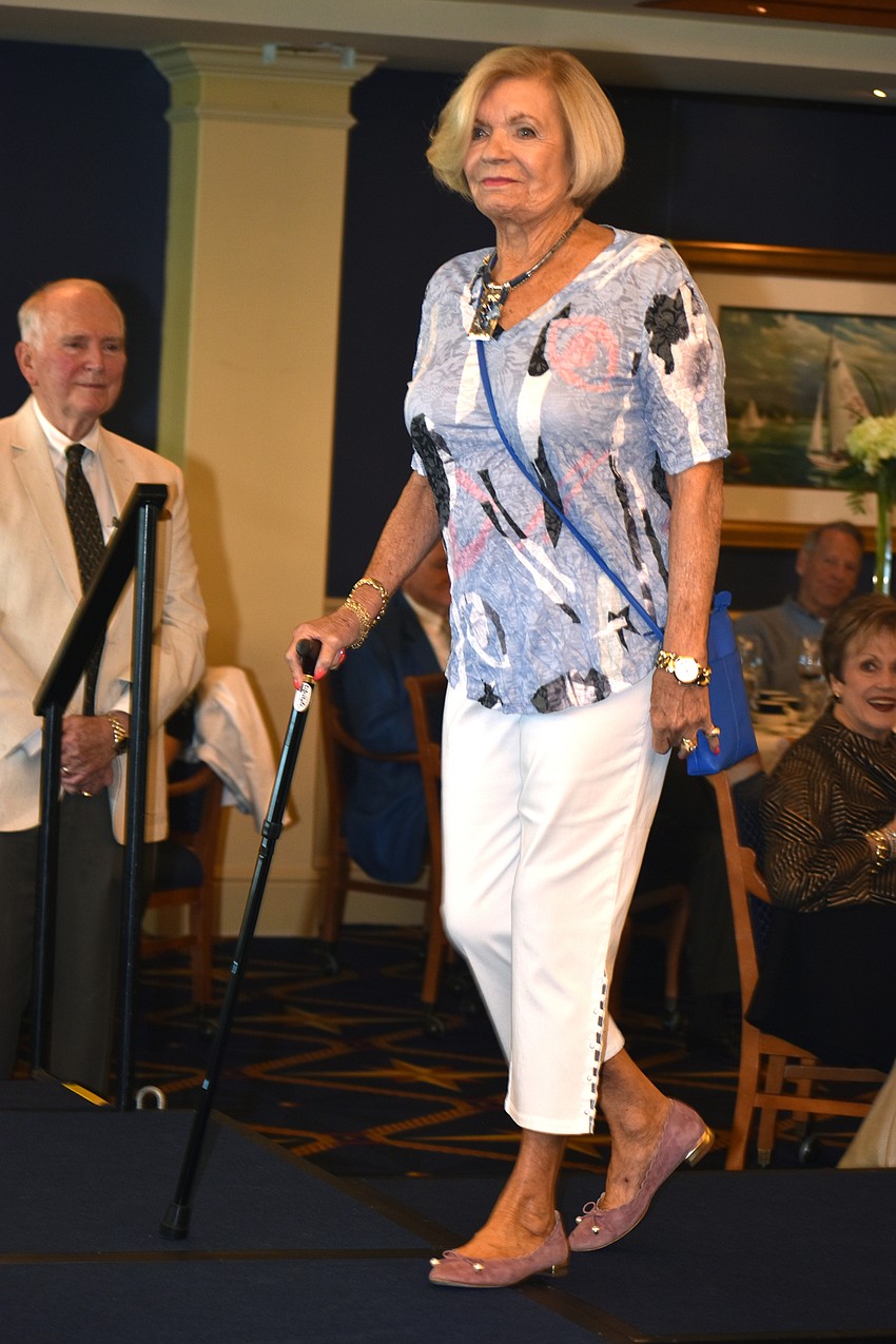 Joyce Steele models clothing from Panache on the runway.