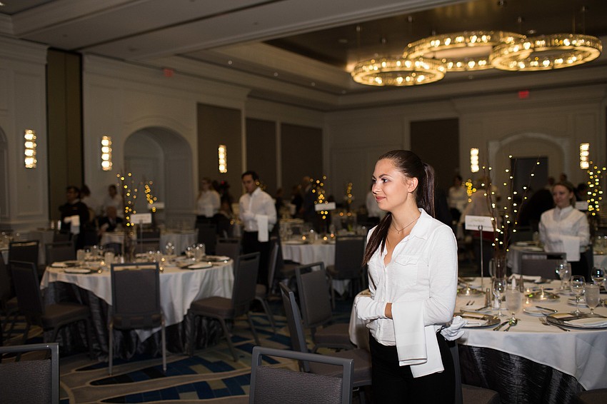 USF student Amber Bixby waits for her table guests to make their way into the ballroom.