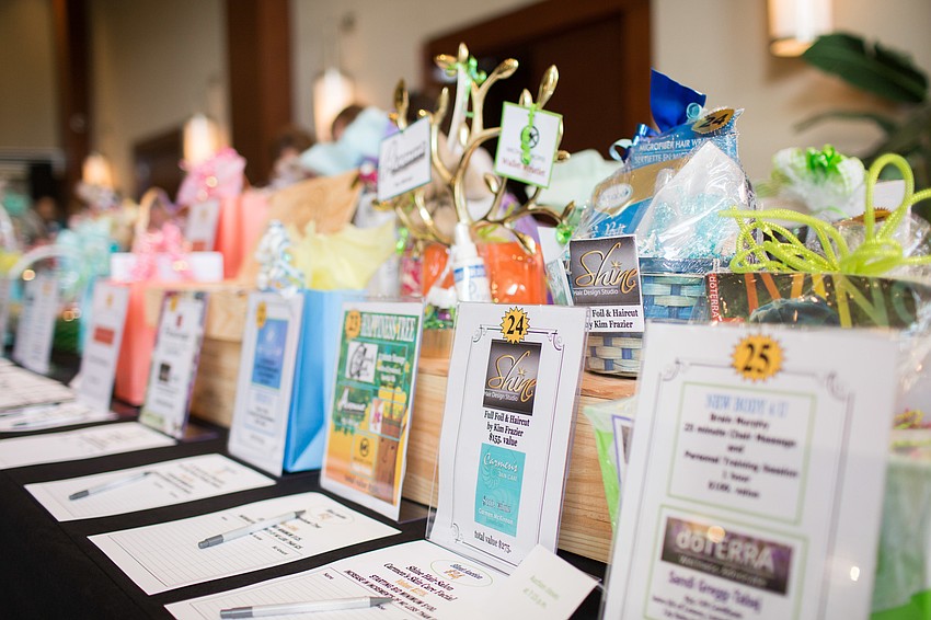 Silent auction items were available for viewing and bidding on.