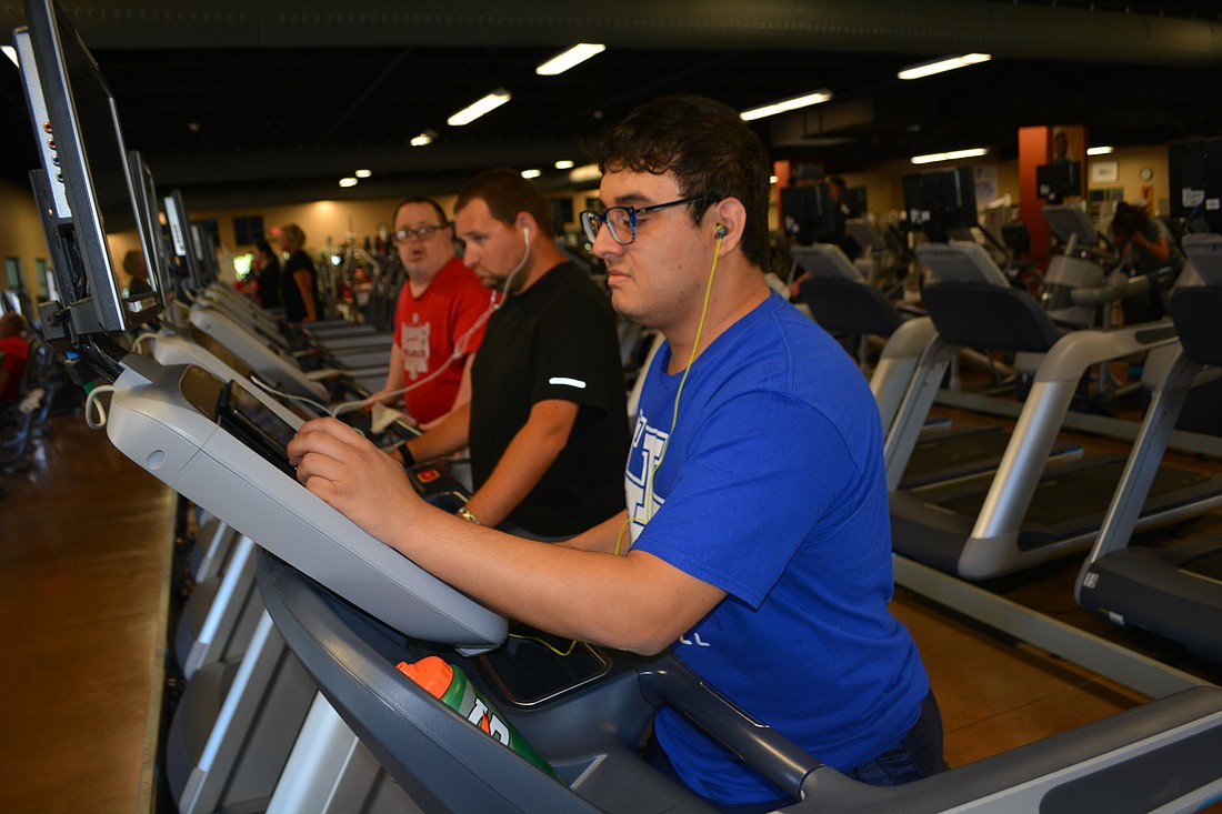 SOAR participant Gianni "Julian" Torres, 24, walks on a treadmill during a one-hour fitness time at the Lakewood Ranch YMCA. He attends SOAR in Parrish and in Lakewood Ranch.