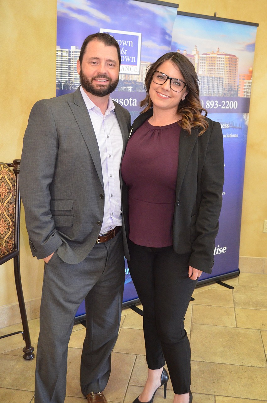 Sarasota's Christopher Staine and Breanca Niski from Brown & Brown Insurance talk as the show starts. Niski also organized the event.