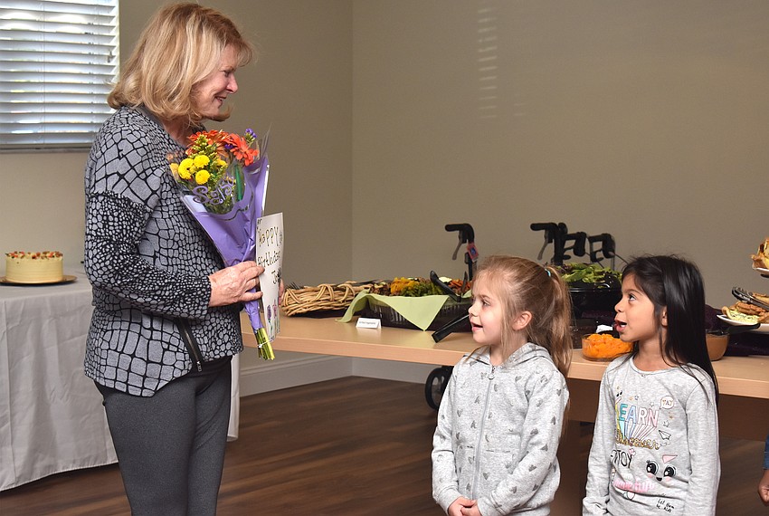 A group of 4-year-olds sings ‘Happy Birthday’ to Jo Rutstein.