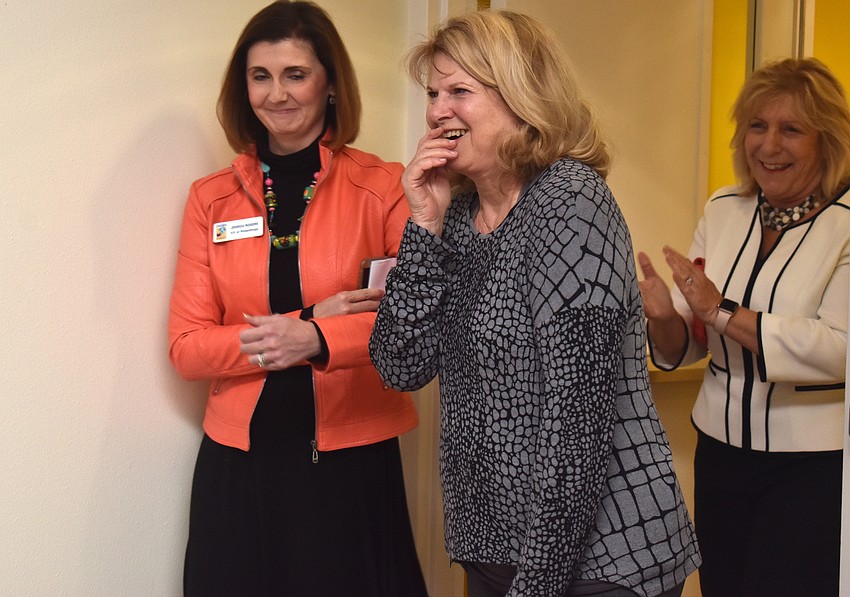 Jo Rutstein is all smiles and a few tears as she arrives at her surprise party.