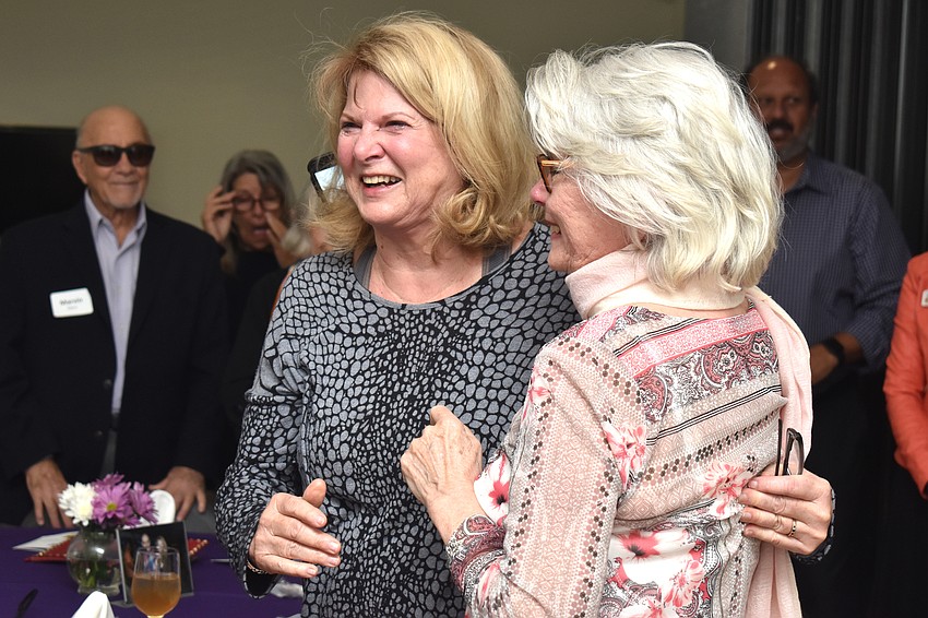 Jo Rutstein stands with her sister Frances Di Martino who surprised Rutstein by flying in town for her birthday.