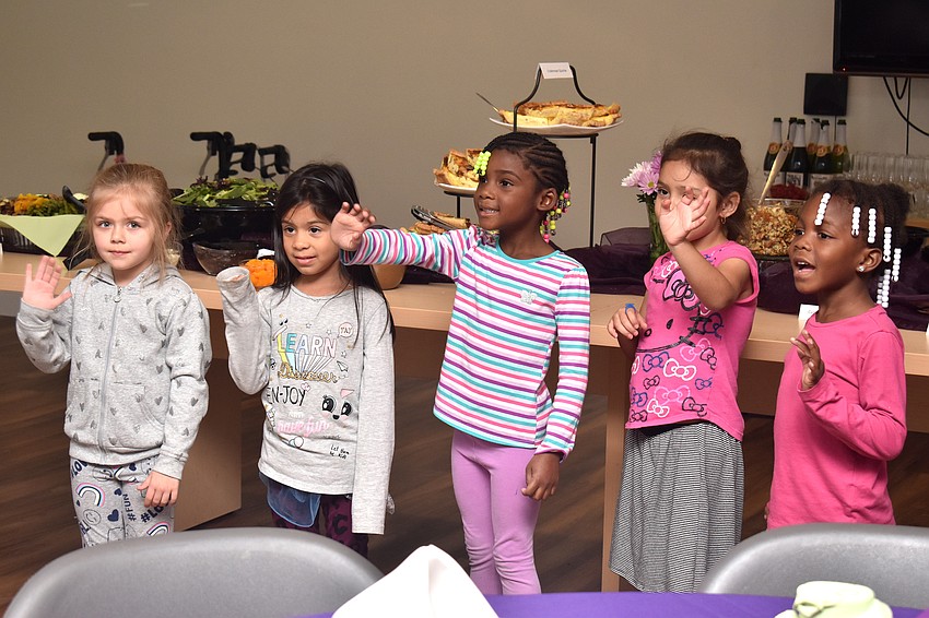 A group of 4-year-olds sings ‘Happy Birthday’ to Jo Rutstein.