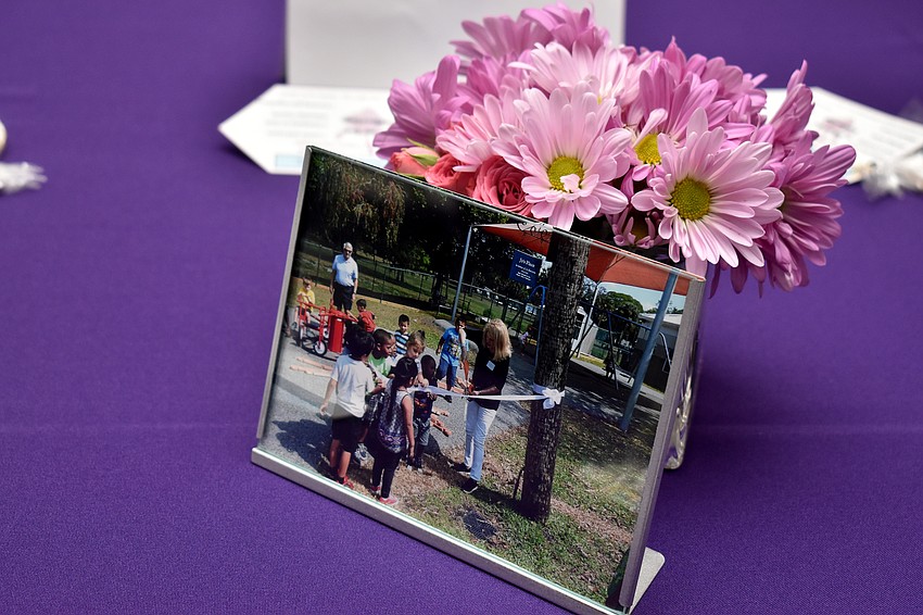 Photos of Jo and Stan Rutstein at Children First functions decorated tables.