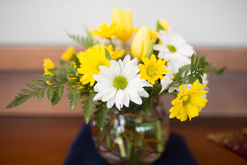 White and yellow flowers decorated the tables.
