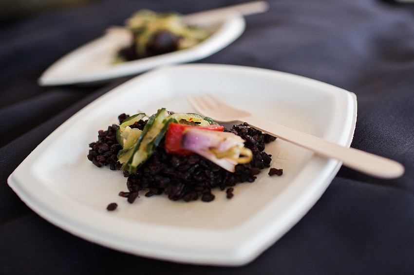 Mattison's served pork belly skewers over rice and cucumber kimchee.