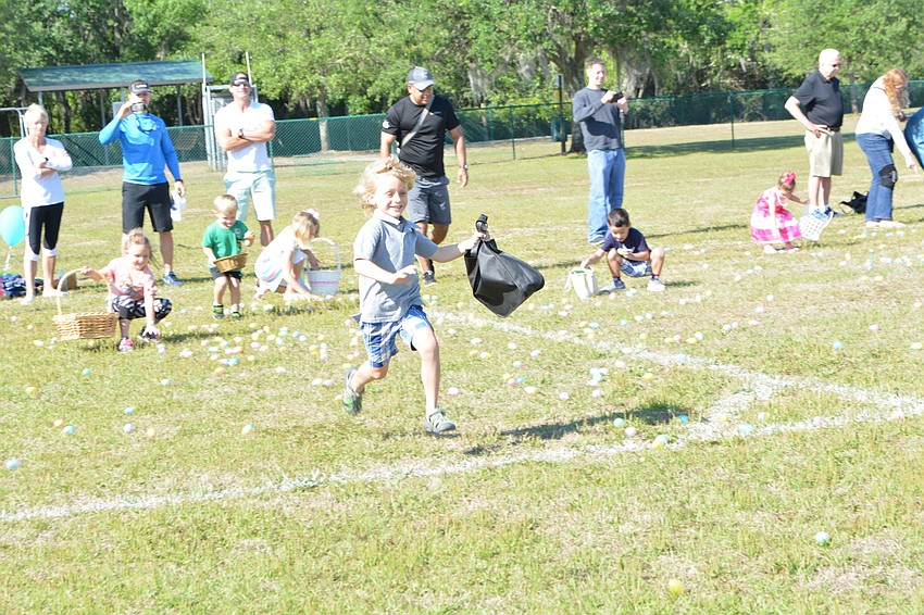 Lakewood Ranch 5-year-old Landon Finch leads the charge on to the egg hunt field.