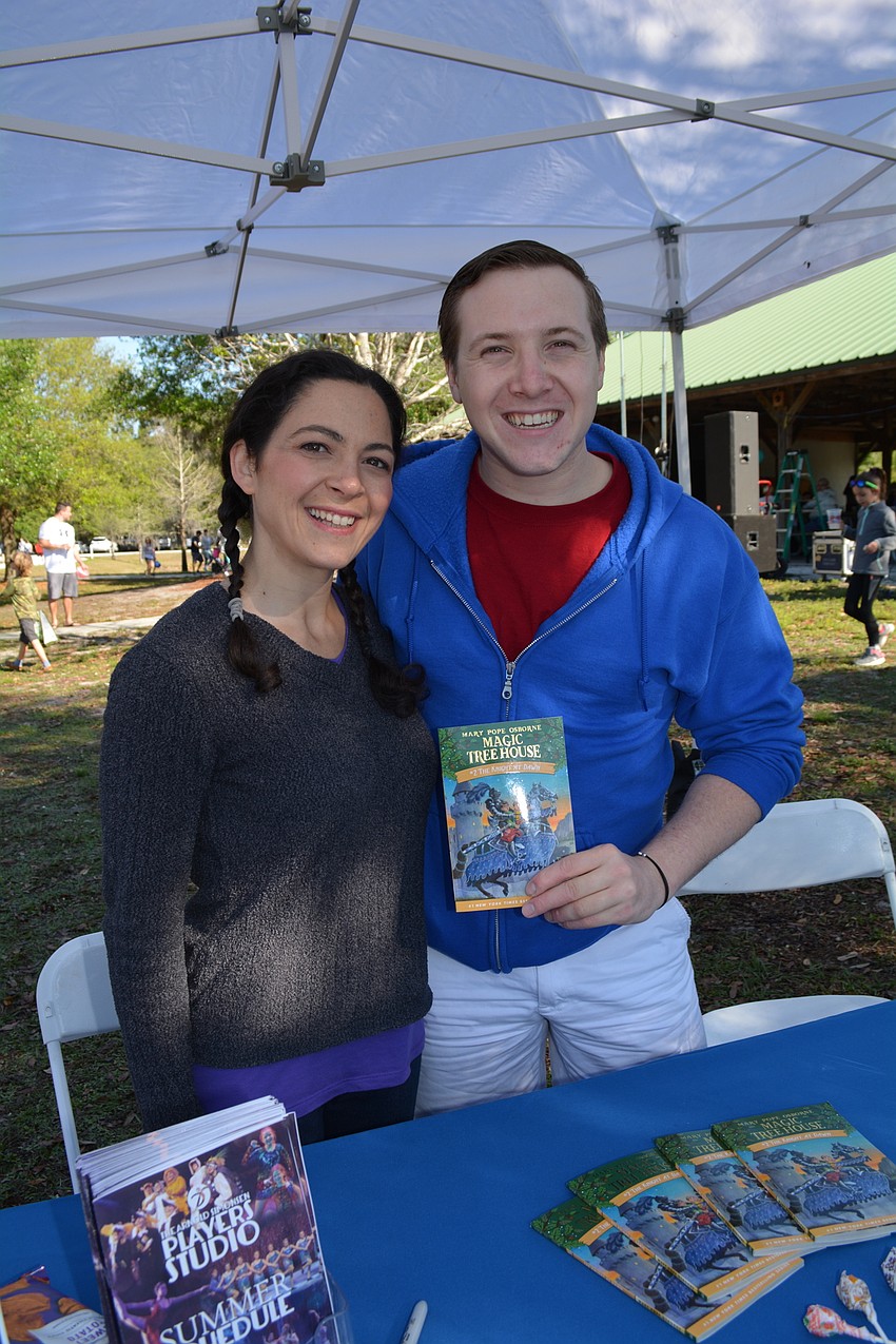 Actors Eliza Engle and Logan Junkins, of The Players Centre for Performing Arts, talk to folks about their 