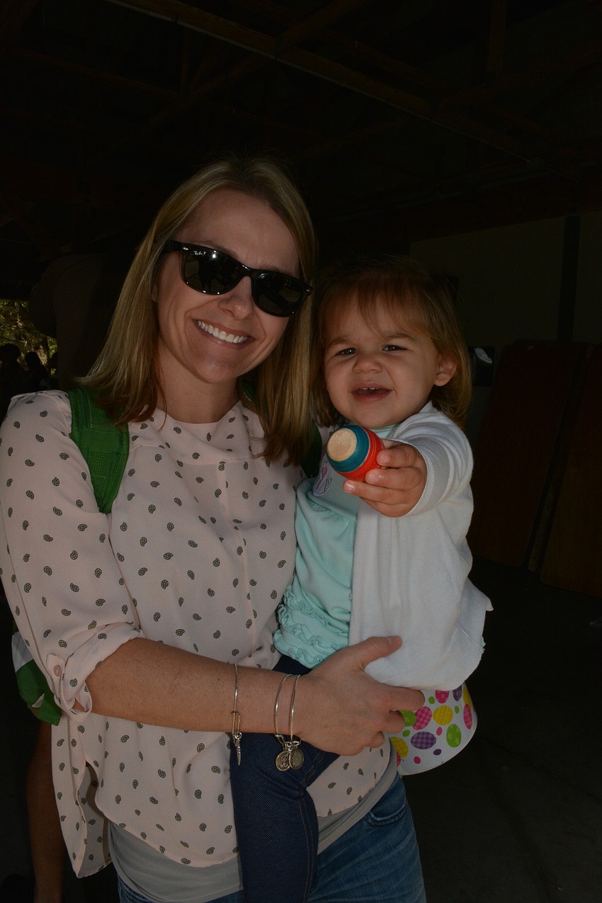 Parrish resident Bo Brault brings her daughter, Emery, to see the Easter Bunny.