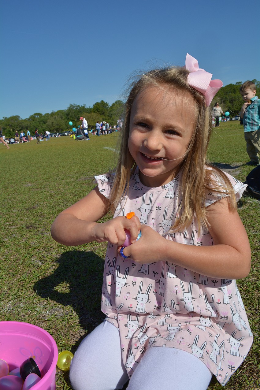 Four-year-old Ava Vogler, of the Country Club at Lakewood Ranch, is most excited about the jewelry she found inside her eggs.