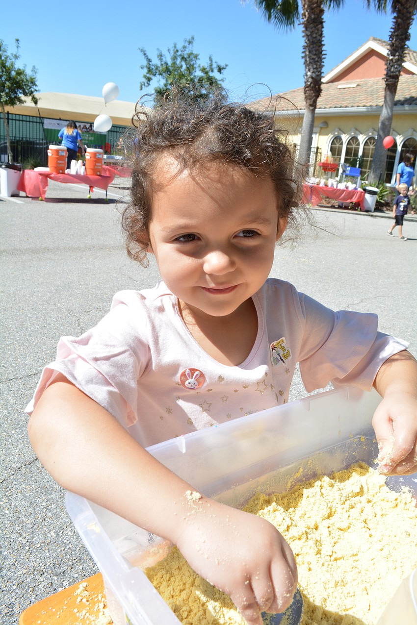 Madeline Plese, 4, bags up some 