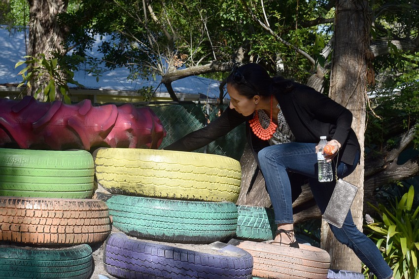Alison Phommachanh hunts for eggs on the children’s playground.