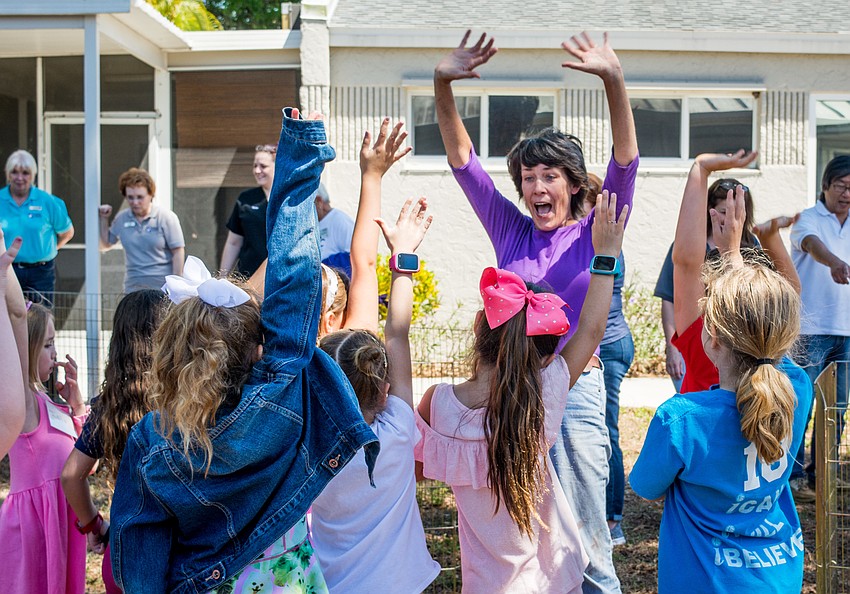Sue McGonagall  gets the campers excited to meet the farm animals.