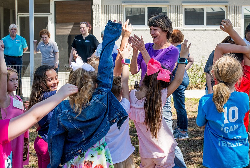 Sue McGonagall  gets the campers excited to meet the farm animals.