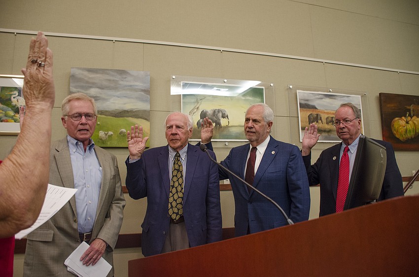 Ken Schneier (left), Ed Zunz, Irwin Pastor and Randy Clair are sworn in to office.