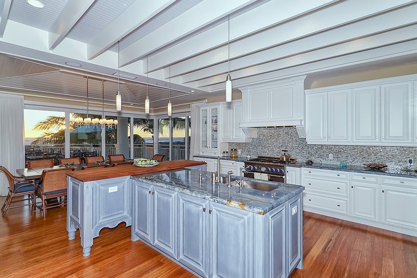 Quartzite counters, stainless steel appliances and an island set off the kitchen.