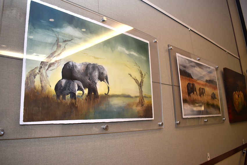 Works by 10 local artist hang throughout town hall including these pieces by Sandy Bogert.