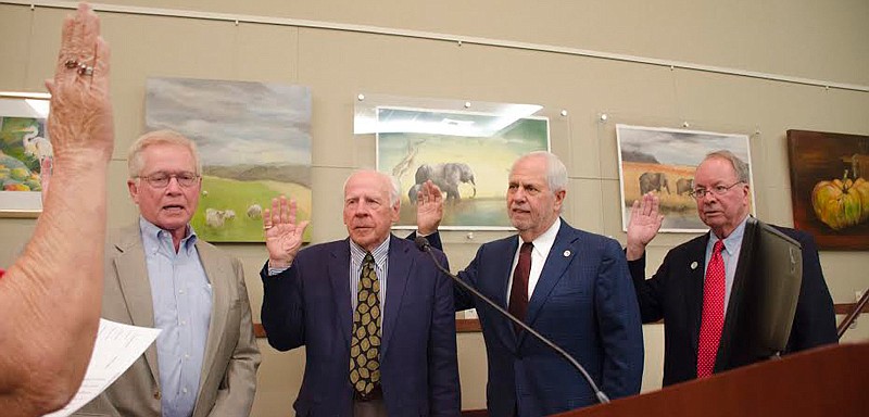 Ken Schneider, Ed Zunz, Irwin Pastor and Randy Clair take the oath of office Monday at Town Hall.