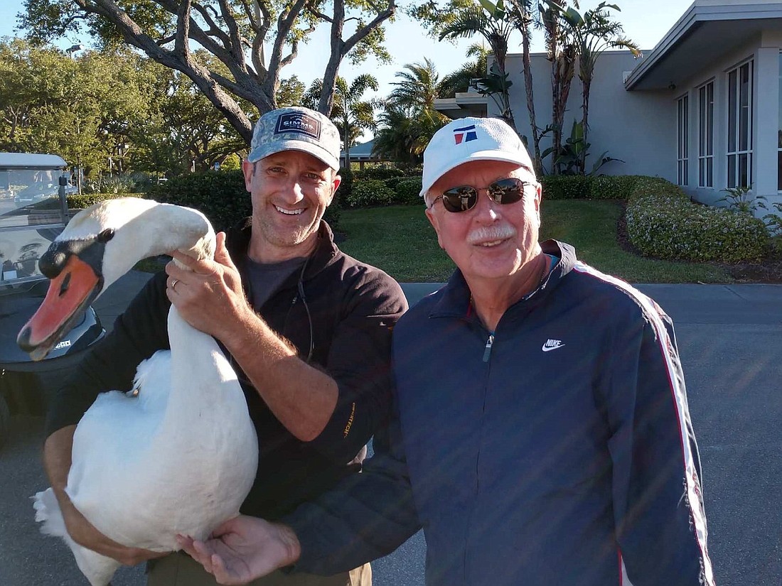 Greg Hebert of Wildlife Inc, and David Novak with Clark  Courtesy photo