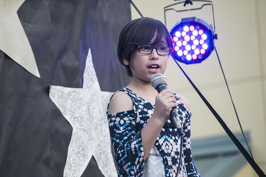 Alathia Samuelsen kept the show rolling with a song.