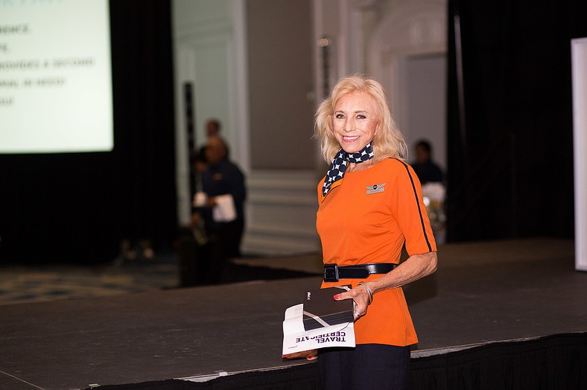 Jet Blue Ambassador Barbara waits to see who is the winner of the roundtrip tickets to a location of the winner's choosing.