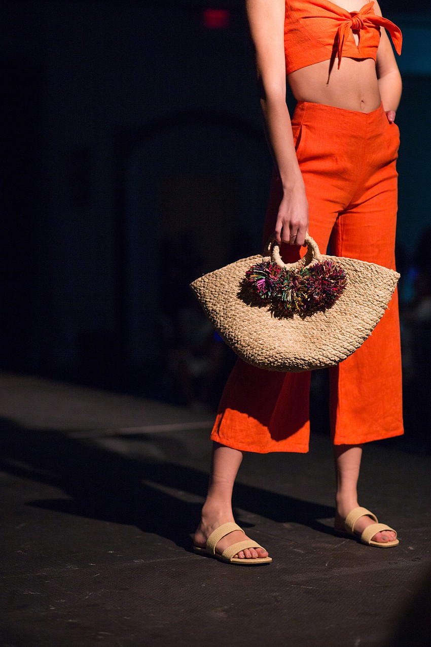 Many models showed off stylish bags and purses.