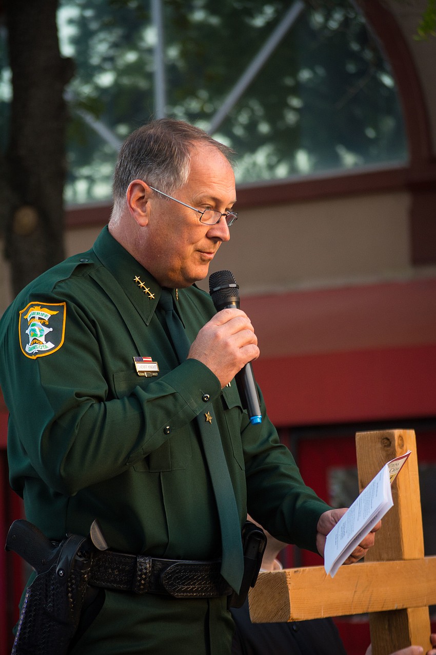 Sarasota County Sheriff Thomas Knight leads the first prayer.