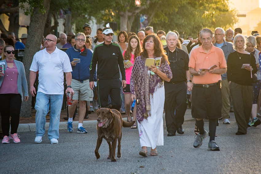 Jennifer Hall with her dog, Major, take part in the Good Friday Walk.