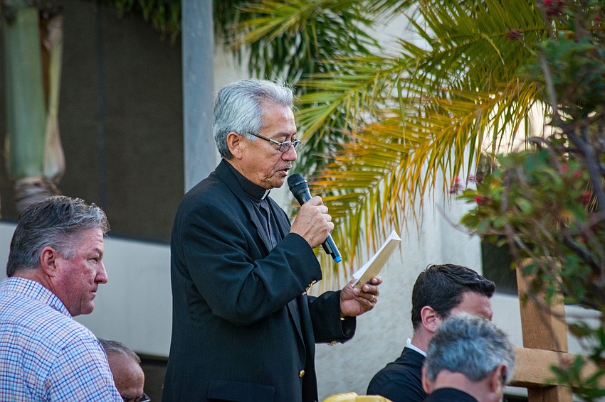 Deacon Humberto Alvia of St. Jude Catholic Church leads a prayer.