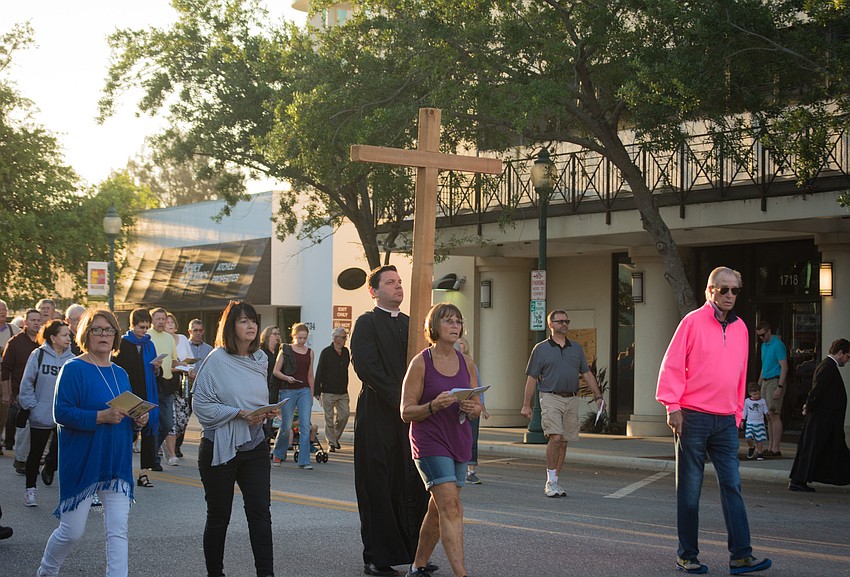 Rev. Chris Wood leads the procession.