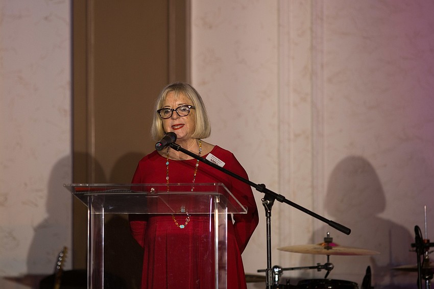 Board Chairwoman Marian Moss welcomes guests to the fete.