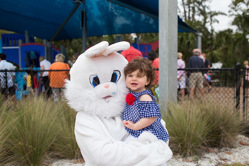 Charlotte McPeak poses for a photo with the Easter bunny.