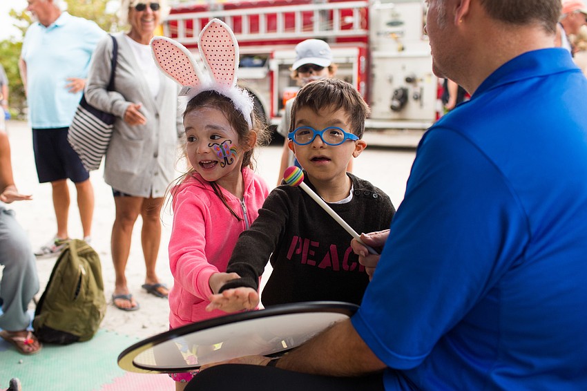 Kate and Wiley Coons play the drums with Positive RePercussions.