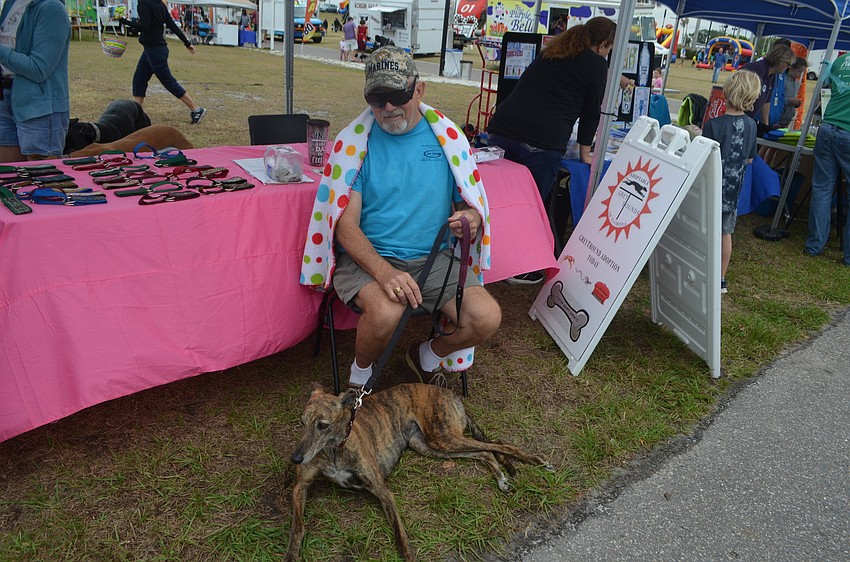Bob Diehl and his greyhound Meggie advertise for Greythound Adoption at Big Truck Day.