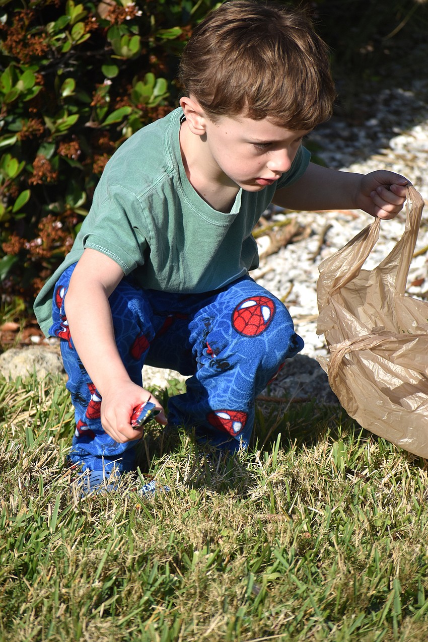 George Mikuldninec grabs candy during the Easter egg hunt.