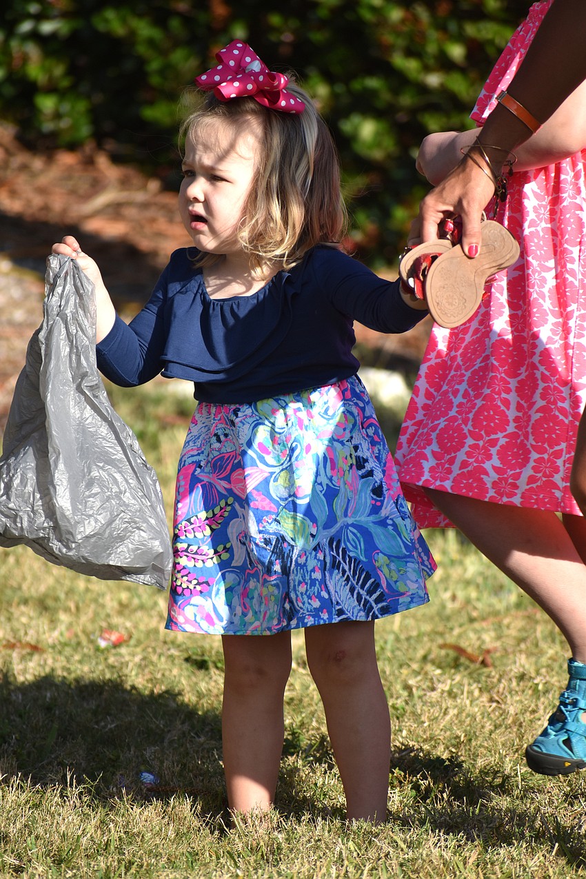 Madeline Lopes searches Casa Del Mar’s lawn for eggs and candy.