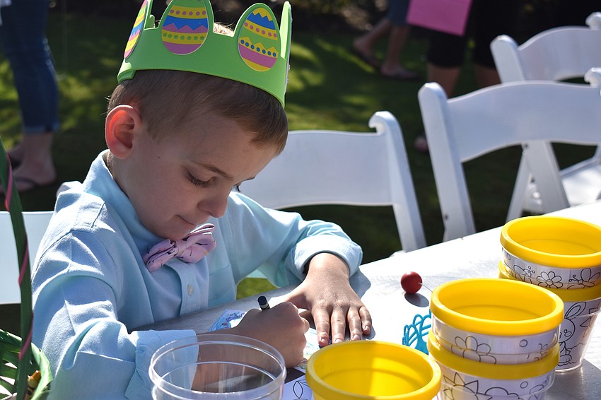 Henry Topol colors before the Easter egg hunt.