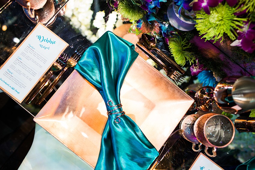 Each place setting was decorated in rose gold accents and a decorative napkin.