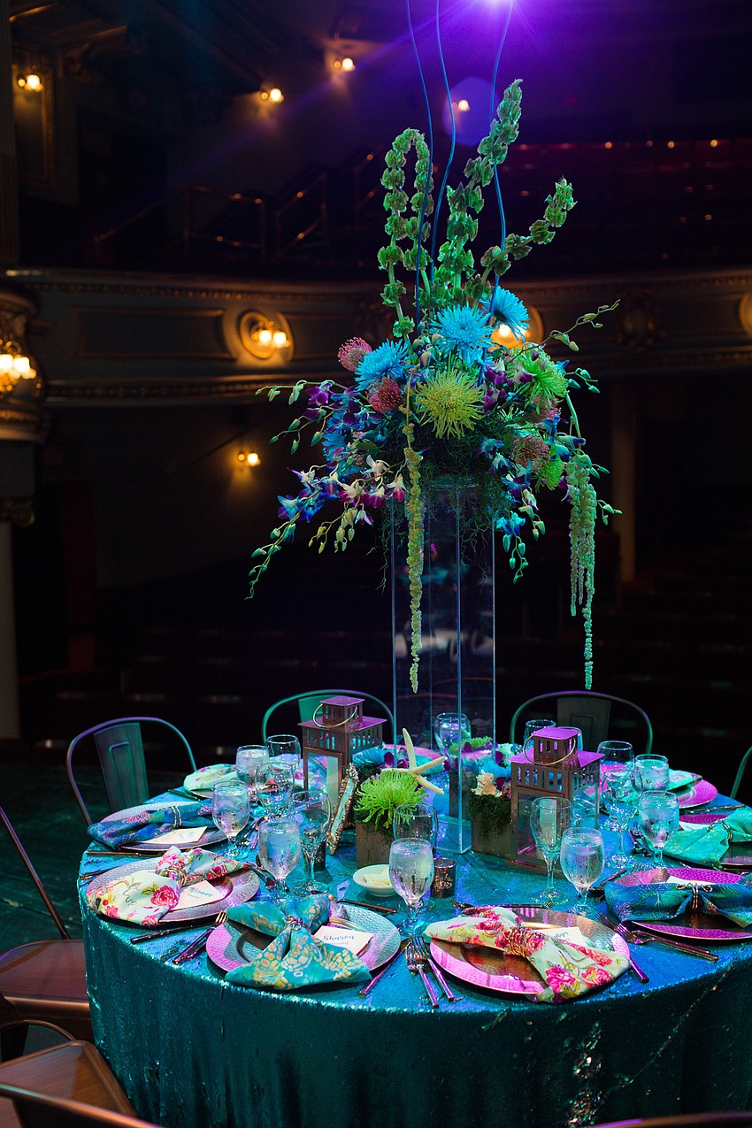 The centerpieces stood tall above the tables.